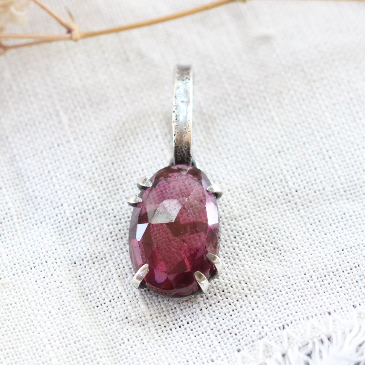 Rose cut Rhodolite Garnet prong set in sterling silver with heart deatail