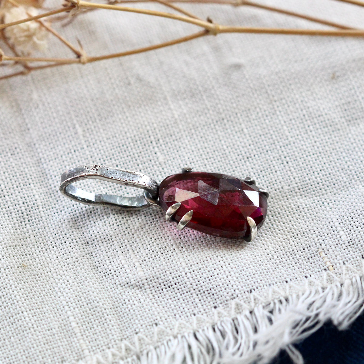 Rose cut Rhodolite Garnet prong set in sterling silver with heart deatail