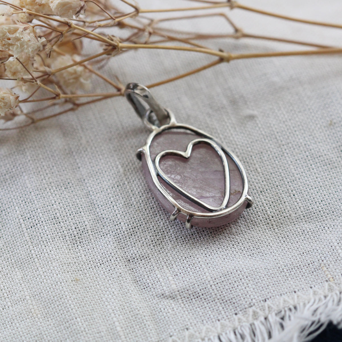 Rose cut Pink Sapphire prong set in sterling silver with heart detail