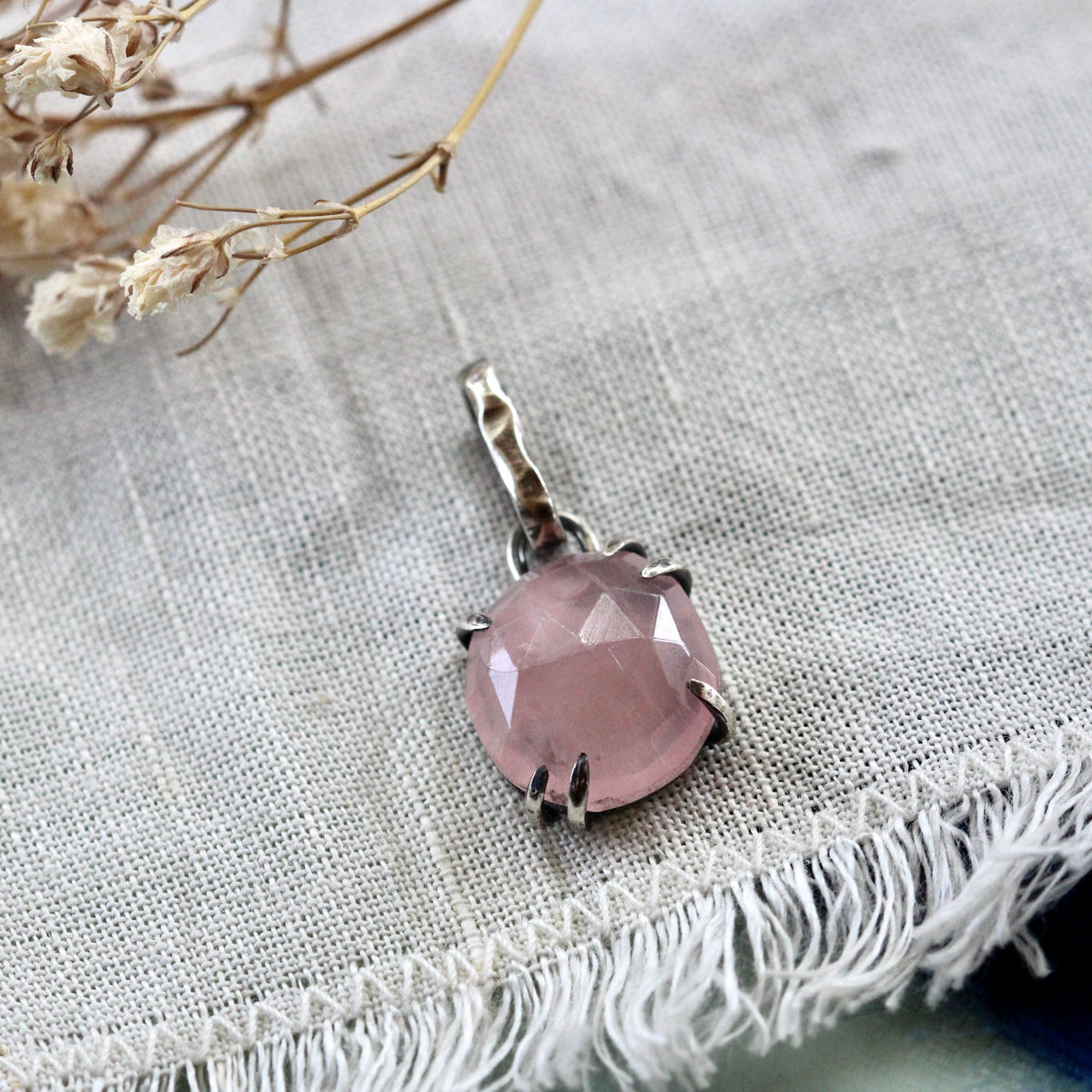 Rose cut Rose Quartz prong set in sterling silver with heart detail