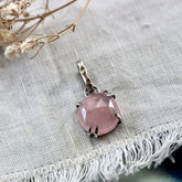 Rose cut Rose Quartz prong set in sterling silver with heart detail