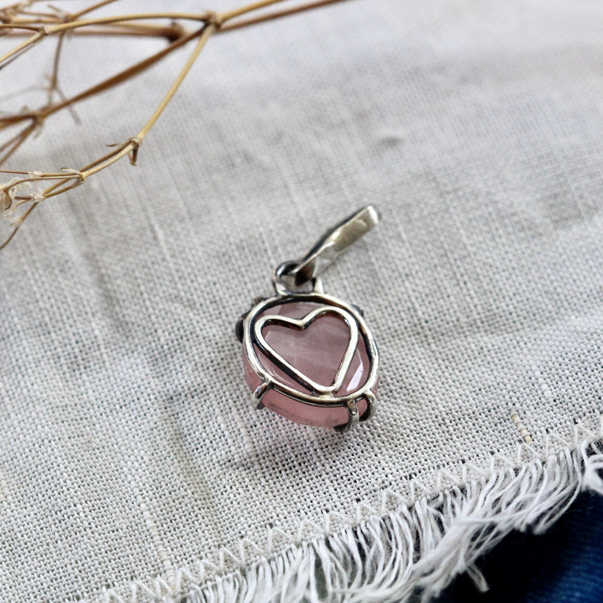 Rose cut Rose Quartz prong set in sterling silver with heart detail