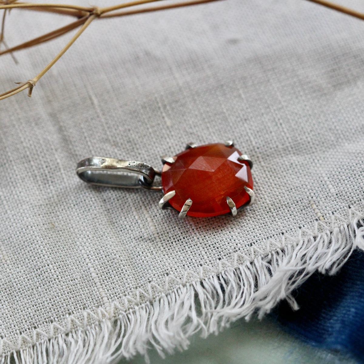 Rose cut Carnelian prong set in sterling silver with heart detail