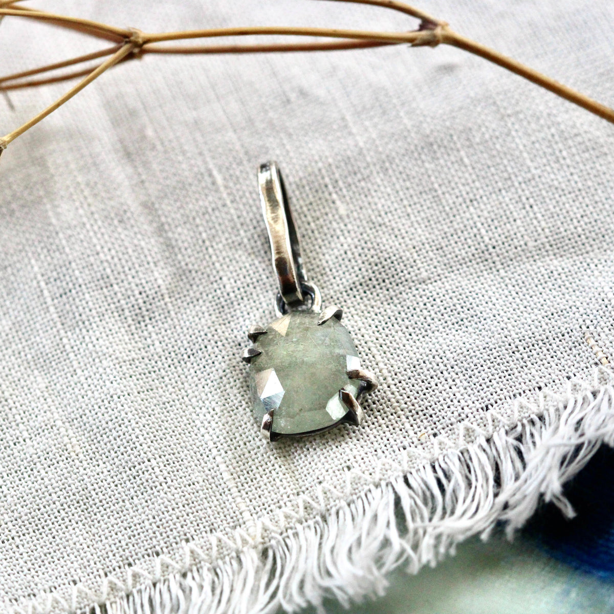 Rose cut green Sapphire prong set in sterling silver with heart detail