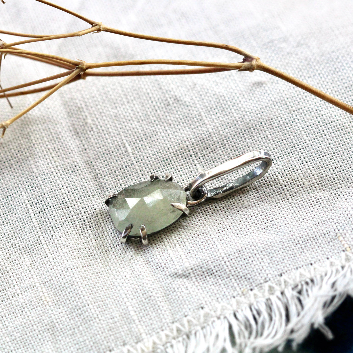 Rose cut green Sapphire prong set in sterling silver with heart detail