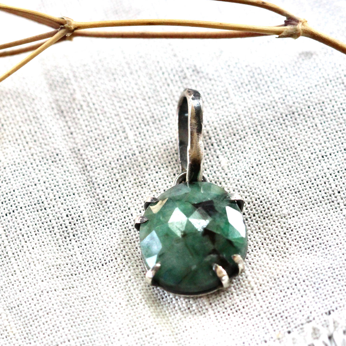 Rose cut Emerald prong set in sterling silver with heart detail