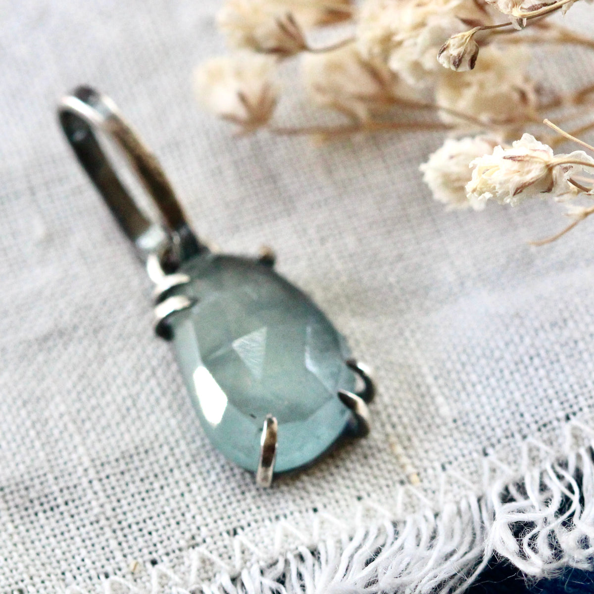 Rose cut Aquamarine prong set in sterling silver with heart detail