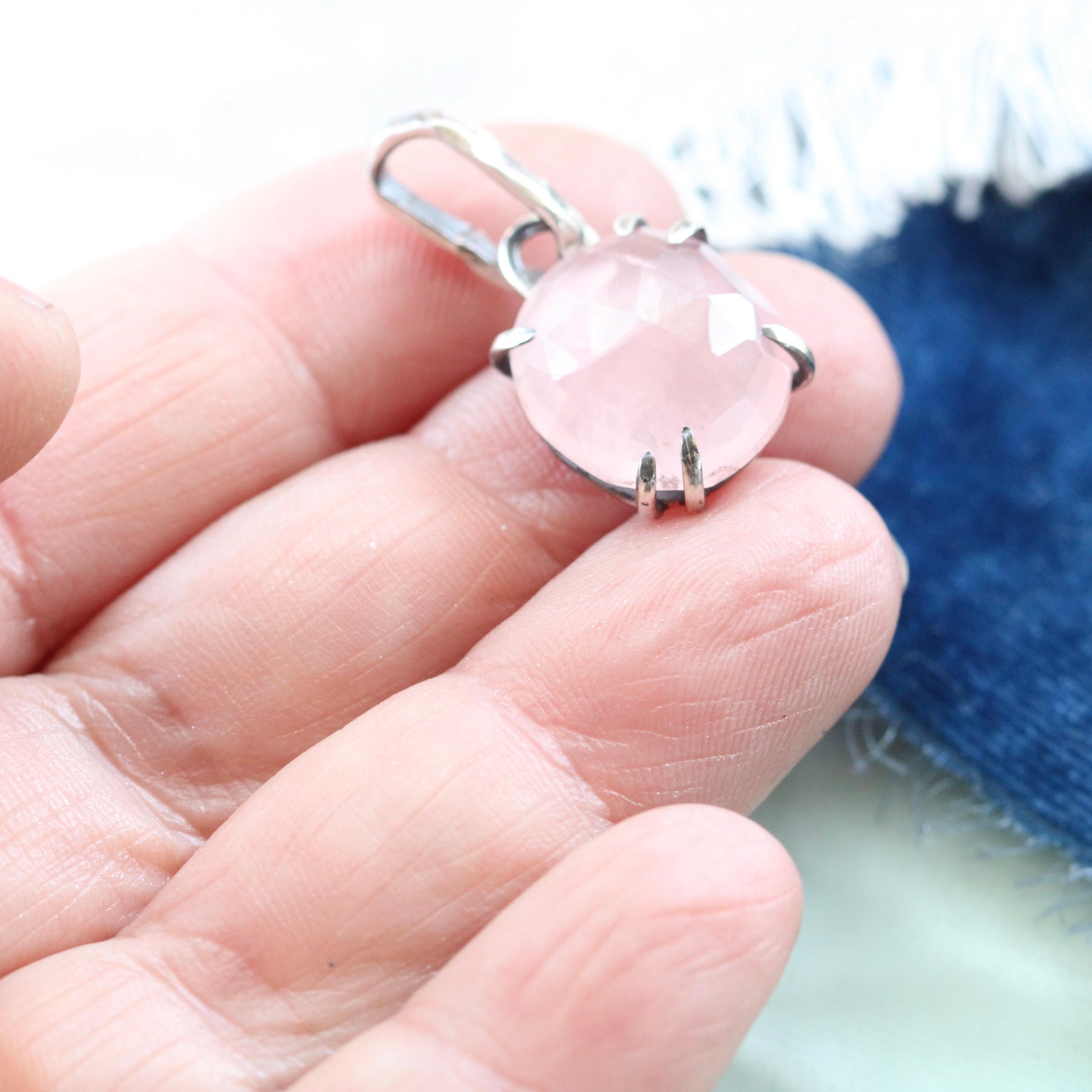 Rose cut Rose Quartz prong set in sterling silver with heart detail