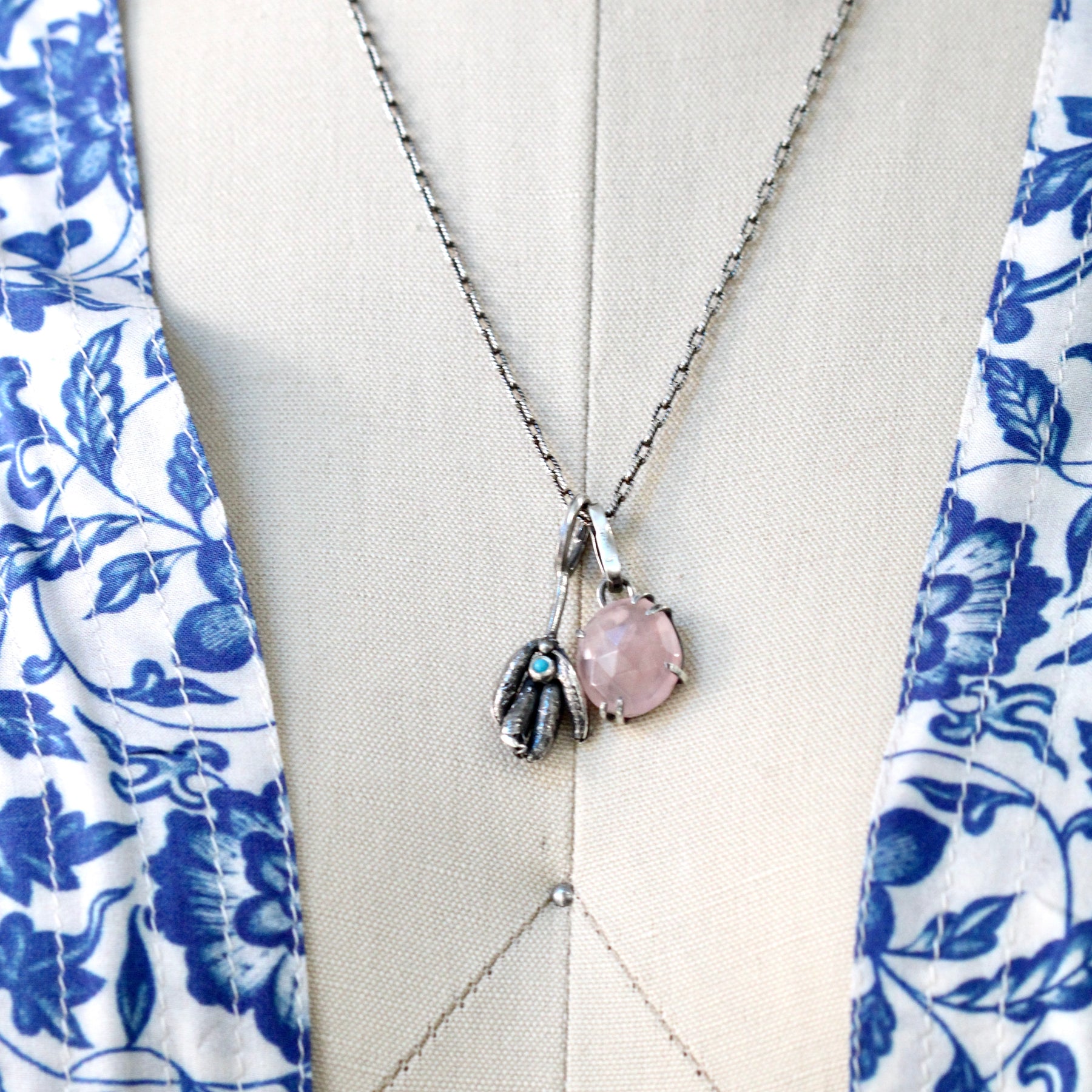 Rose cut Rose Quartz prong set in sterling silver with heart detail