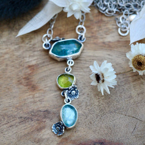 Wildflower wanderings Kyanite peridot and poppies necklace