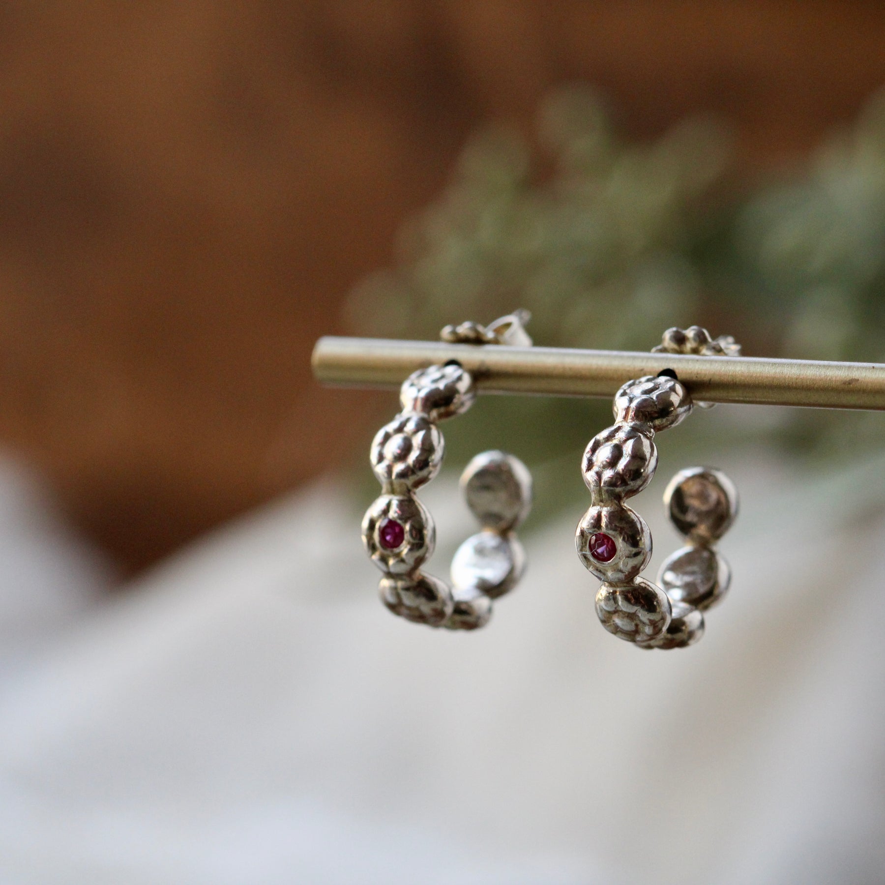 Clearance Sale floral pattern sterling silver hoop earrings with flush set rubies