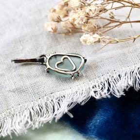 Rose cut Aquamarine prong set in sterling silver with heart detail