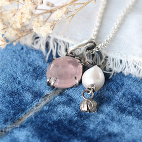 Rose cut Rose Quartz prong set in sterling silver with heart detail