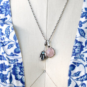 Rose cut Rose Quartz prong set in sterling silver with heart detail