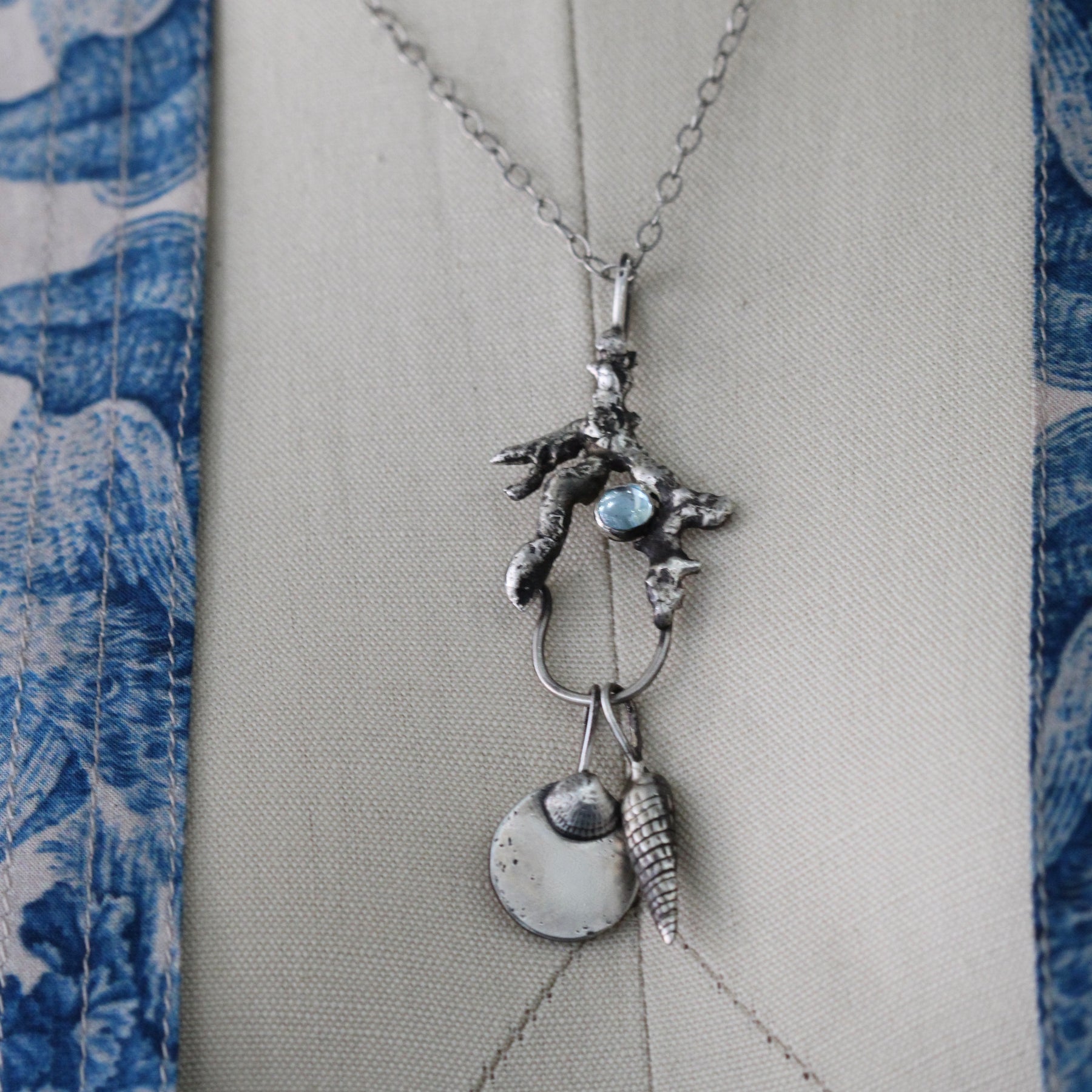 Long Spiral Shell with blue topaz Charm Pacific Coast Collection
